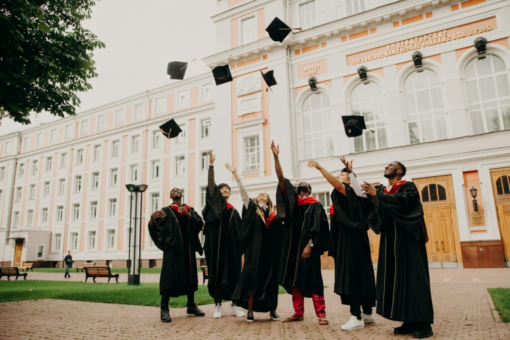 Graduates throwing their caps in the air