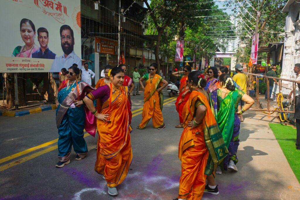 Dancers in colourful traditional clothes dancing garba